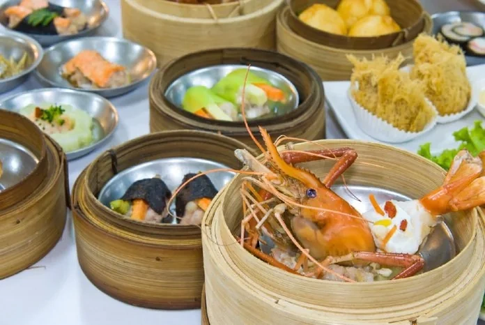 Traditional Cantonese dim sum spread with steamed and fried delicacies