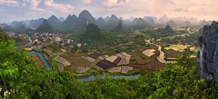 Limestone karst peaks rising from mist near Yangshuo, Guilin