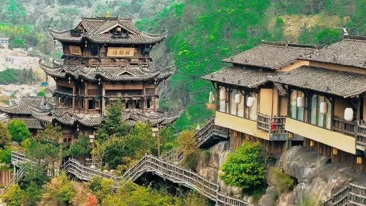 Wangxian Valley cliff village in mist