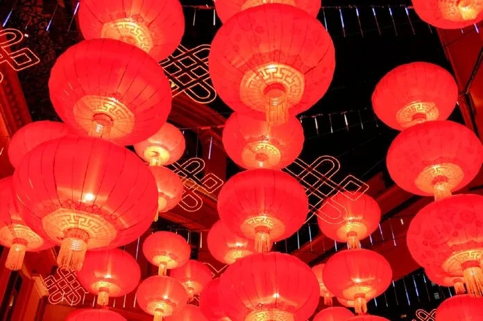 Traditional Chinese New Year decorations with red couplets and festive ornaments adorning a doorway