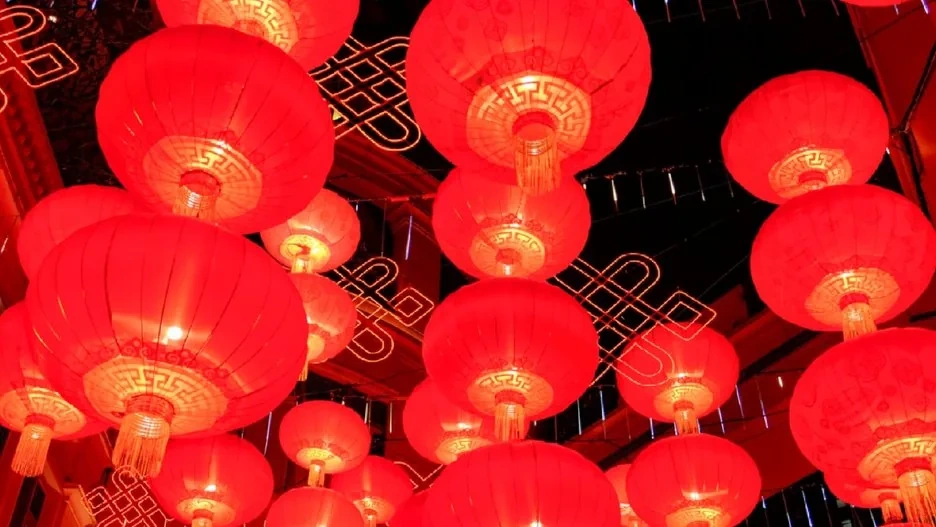 Vibrant Spring Festival celebrations with red decorations, fireworks, and festive crowds