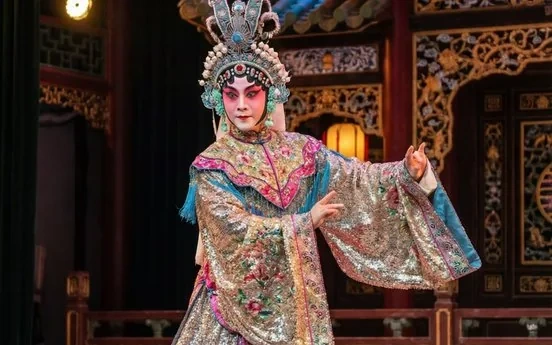 A Cantonese Opera performer in dazzling embroidered costume